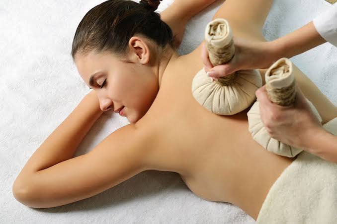 Warm traditional Thai herbal compress therapy